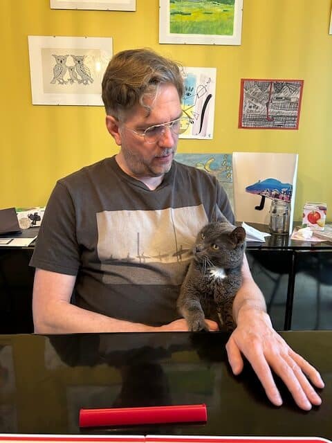 Mr. Slim Shady, a lovely old cat! 2 Mr. Slim Shady, the adopted senior cat, comfortably relaxing in his new home, showcasing a successful integration.