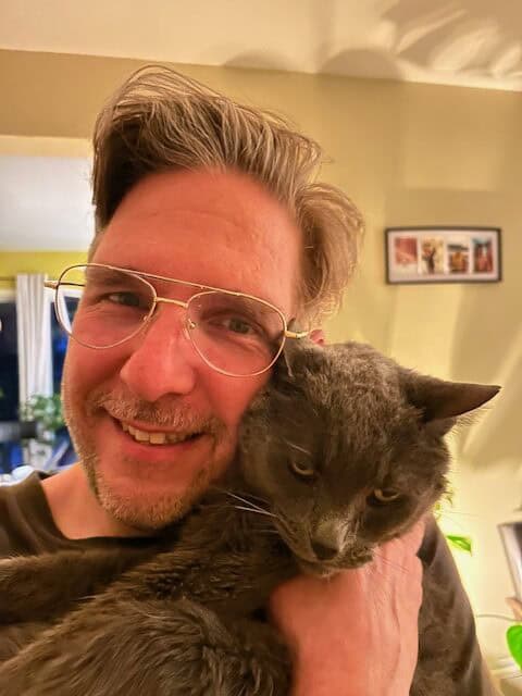 Mr. Slim Shady, a lovely old cat! 1 Mr. Slim Shady, a senior cat, looking lovingly at his new owner during the adoption process.